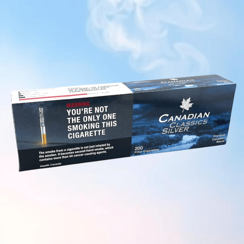 Carton of Canadian Classics Silver on a blue background with a bit of smokes